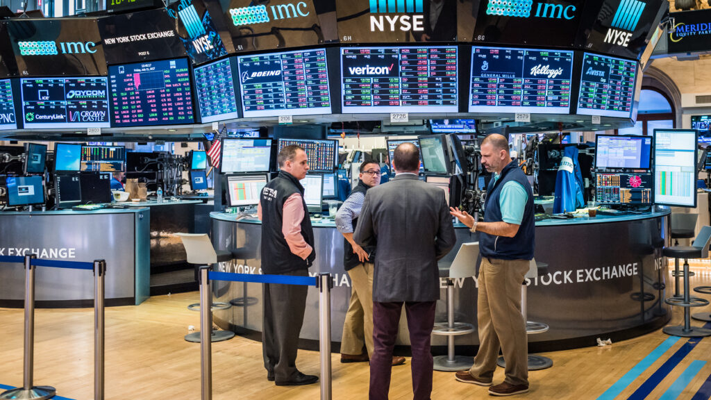 People working on the floor of the New York Stock Exchange (NYSE)  