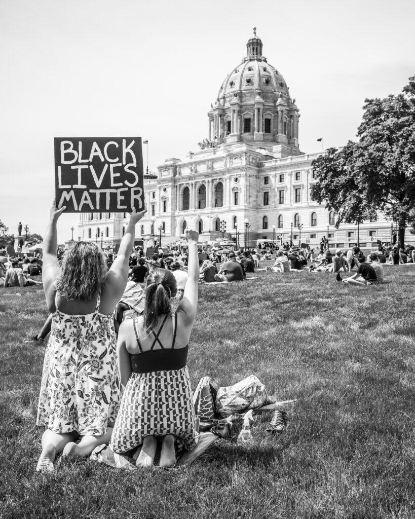 hold sign at black lives matter demonstration in Minnesota.