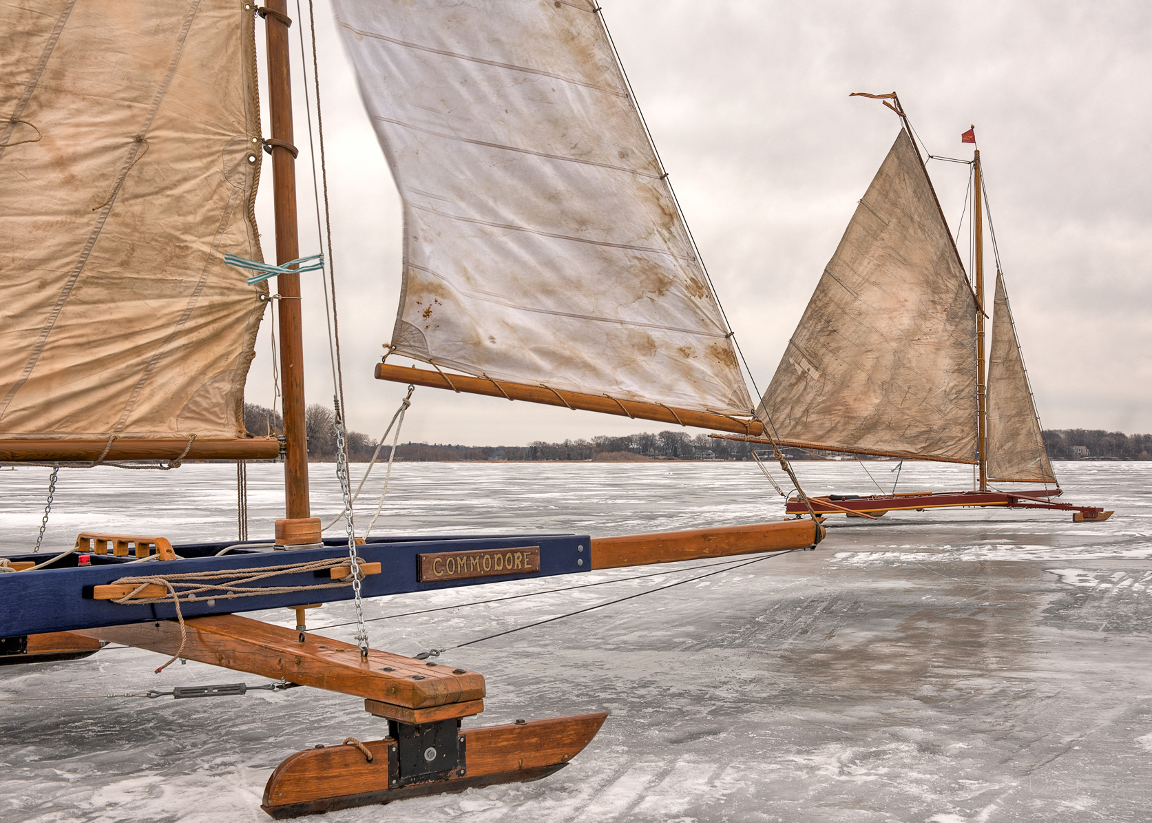 antique wood iceboats on frozen lake