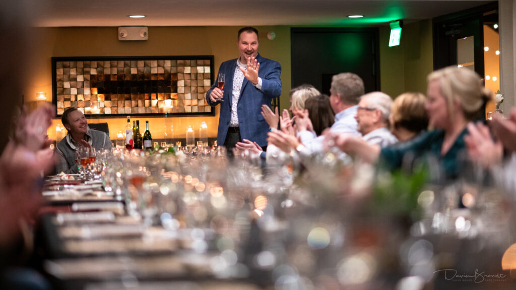 Sommelier speaking at a wine tasting event