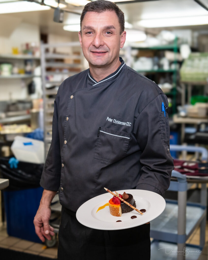 chef displaying a delicious dessert 