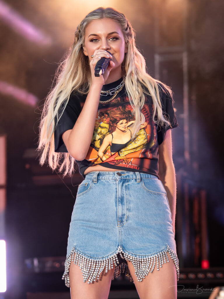 Kelsea Ballerini on stage singing