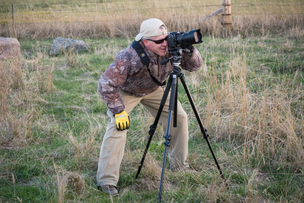photographer taking landscape photo